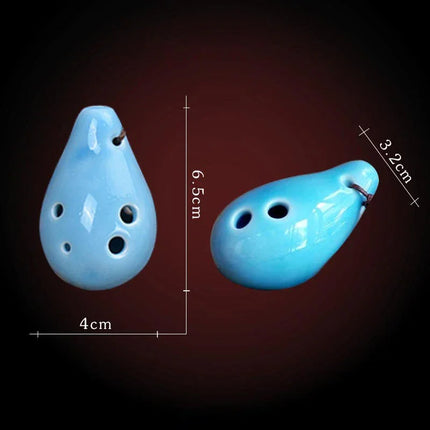 Ocarina en céramique bleue Sonora-Mundi, 6,5 cm, vue avant et côté sur fond noir