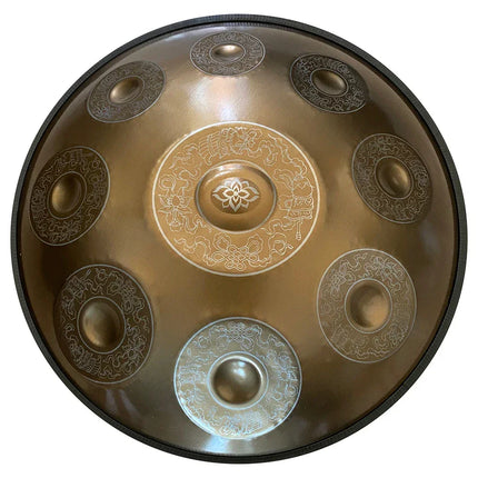 Handpan Sonora-Mundi en métal gravé, motif floral central et notes décorées, vue de dessus